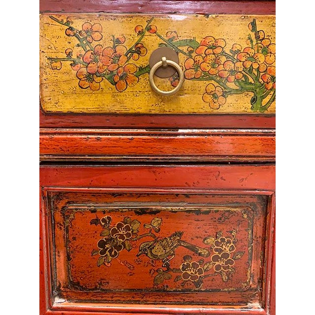 Asian antique hand painted tall cabinet is made out of elm wood. It has 2 drawer and 2 doors, and 2 removable shelves. It...