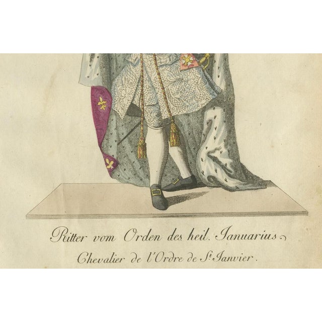 Knight of the Illustrious Order of Saint Januarius in Ceremonial Robes : This hand-colored engraving depicts a...