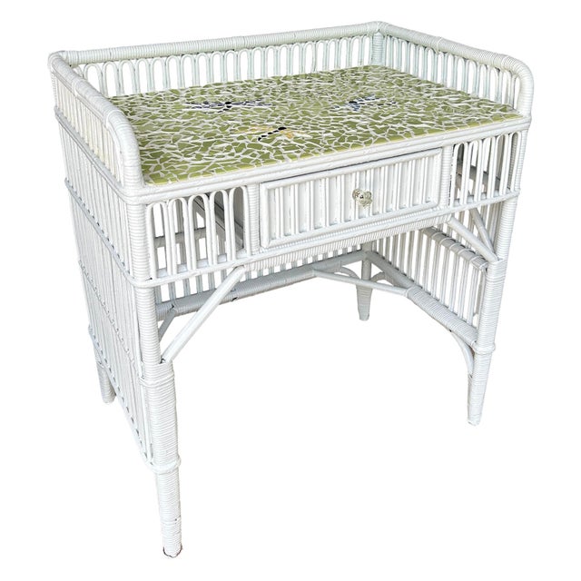 This unique antique wicker rattan desk offers a touch of whimsy with its mosaic tile top featuring 3 dragonflies. It can...