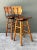 Designed in the distinct utilitarian manner of Arthur Umanoff, this pair of mid-century modern bar stools combines warm...