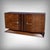 This Art Deco veneered sideboard boasts an elegant, architectural silhouette where curved lines, symmetry, and the depth...