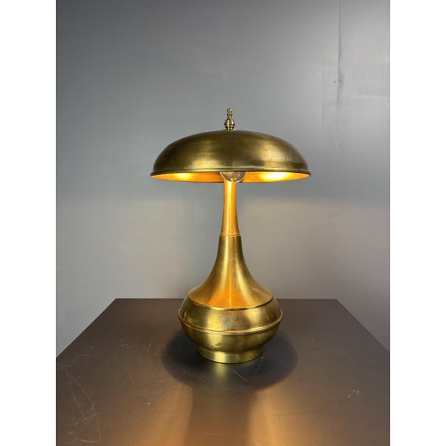 Solid brass table lamp, Italian, circa 1960s. A restrained modernist piece with a generous hemispheric dome shade topped...
