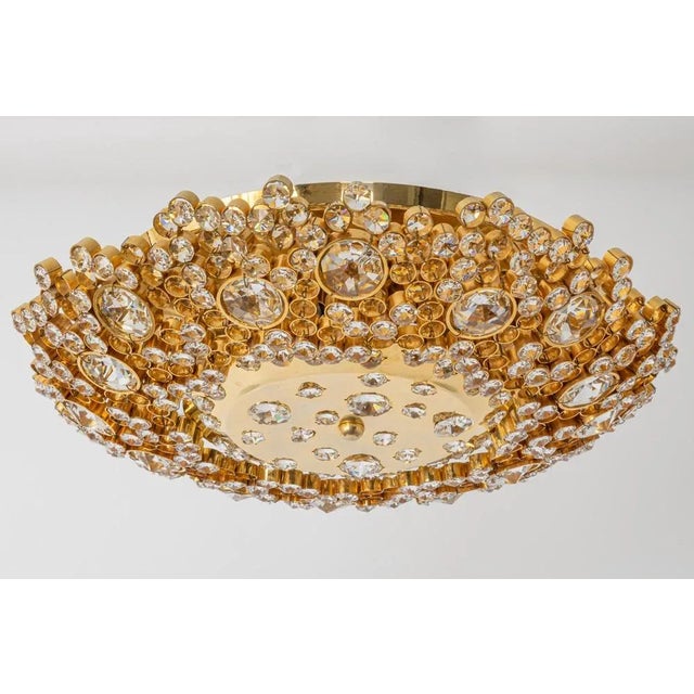 Delicate floral flush mount light with crystal glass and gilded brass parts made by palwa, germany, 1970s. Featuring a...