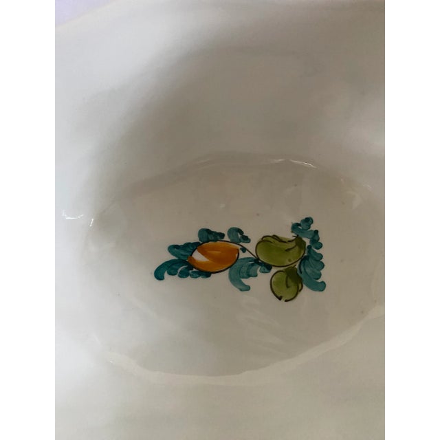 Colorful Greek pottery lidded bowl with green, blue, rose, aqua and yellow.