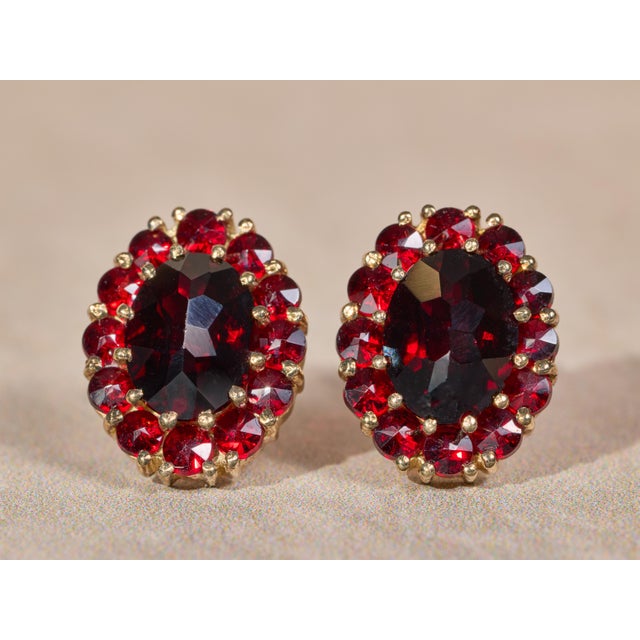 The Coronados Ladies 14K Yellow Gold Bohemian Earrings set with Garnet. Crafted in 14 karat yellow gold, these ladies oval...