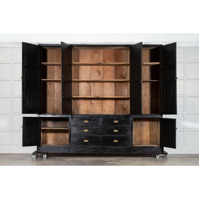 Circa 1890 monumental 19thc english ebonised pine housekeepers cupboard together w273 x d54 x h235.5 cm base w273 x d52.5...