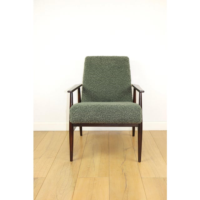 Armchair 'Lis', 1970s, green boucle, design by Henryk Lis. 2 pieces available. Restored iconic Henryk Lis armchair from...