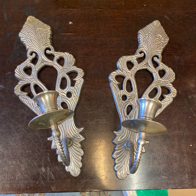 Beautiful pair of silver plated wall sconces. Perfect for any space or the interior designer.