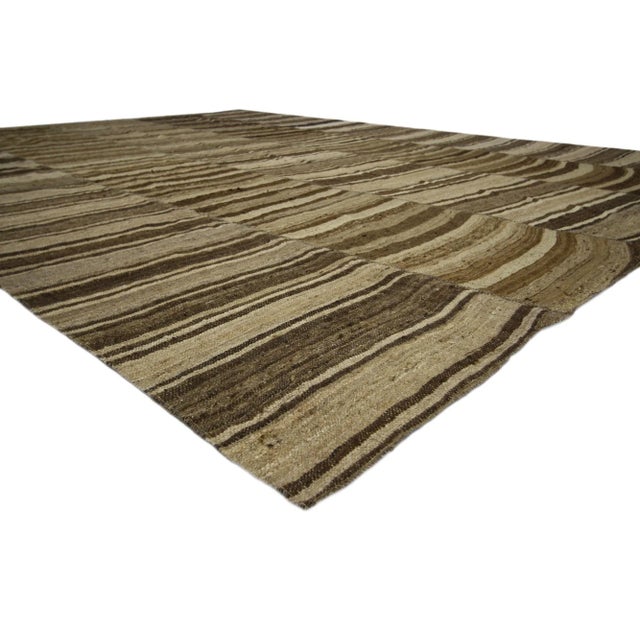 60631 Vintage Turkish Kilim Rug with Earth-Tone Colors, 10'09 x 13'09. Wabi-Sabi embraces rustic finesse in this handwoven...