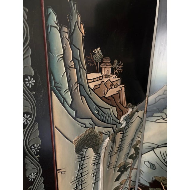 Vintage Chinese export four-panel coromandel lacquer folding screen. Hand-incised and polychrome-painted landscape scene...