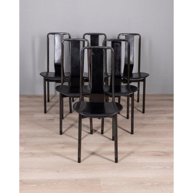 Pair of black metal chairs with black leather seats, Irma model, designed by Achille Castiglioni for Zanotta, 1970s. This...