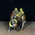 This is a charming vintage Chinese gilt bronze sculpture depicting two young herders riding on the back of a water...