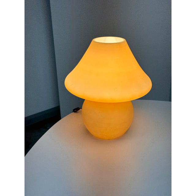 Design Plus Gallery presents a Vintage Glass Mushroom Table Lamp. The Vanilla Amber-toned glass body combines a rounded...