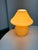 Design Plus Gallery presents a Vintage Glass Mushroom Table Lamp. The Vanilla Amber-toned glass body combines a rounded...