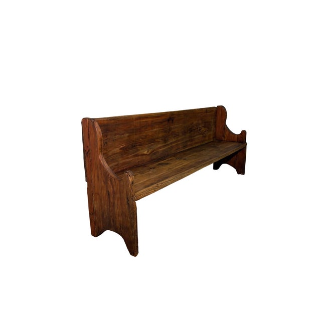 An authentic rustic bench dating back to the late 19th century, crafted from fine mountain larch wood, a wood...