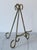 Vintage metal brass tone art easel. No makers mark. Some age wear to finish.