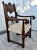 Antique - Circa 1900's Arm Chair has a Tudor Style. The Frame is Walnut. Ornately Carved Wood. Stretcher Base. Patterned...
