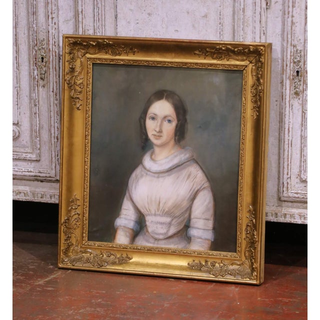This elegant antique portrait was crafted in France circa 1850 and depicts a young woman in a softly composed three-...