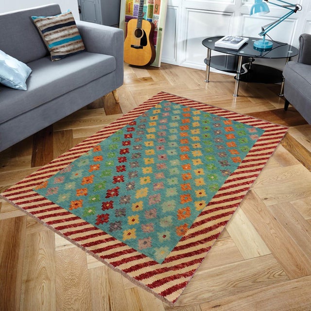 This stunning hand-knotted Afghan Balouchi rug is a captivating addition to any decor. Crafted by skilled artisans, it...