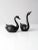 This is a pair of mid-century brass swans. Painted black, the brass figurines have sleek lines and lovely patina. 7.75" x...