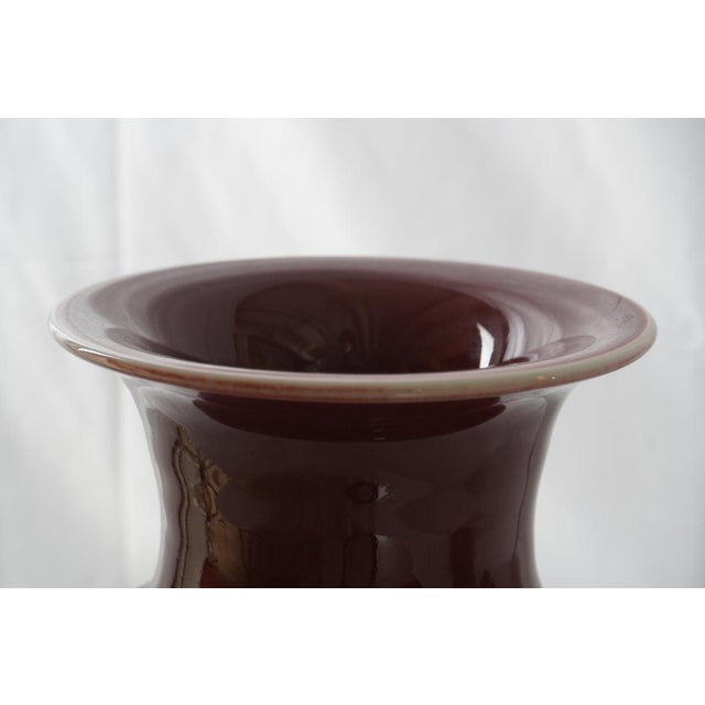 Antique Chinese Porcelain Oxblood Vase, 19th C to early 20th C, a timeless piece distinguished by its deep, lustrous sang-...