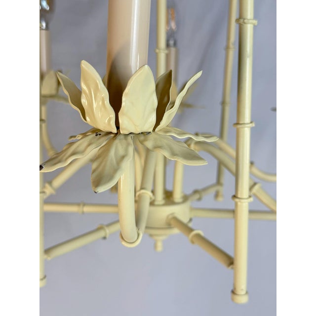 This is a charming vintage faux bamboo chandelier with five lights and sculpted leafy tole accents throughout. This is...