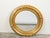An English giltwood round mirror from the 19th century, with carved flowers and etched motifs. Created in England during...
