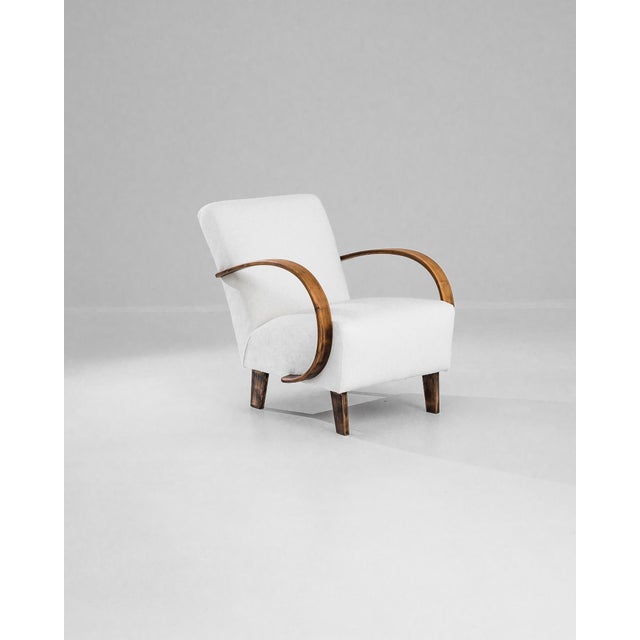 Discover the timeless elegance of this 1950s Czech Wooden Armchair, a masterpiece crafted by the renowned designer J....