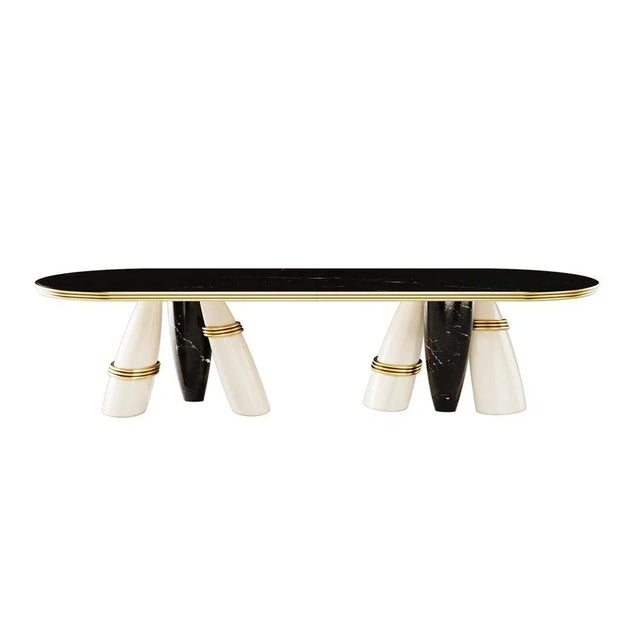Billie Dining Table owns a striking attitude and sculptural shapes. A modern marble table with polished brass details...