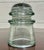 This is an antique Armstrong aqua glass electrical/telephone insulator, featuring thick molded glass construction and the...