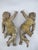 Vintage pair of carved, gilded wooden angel figures, or putti, each with outstretched arms holding a cross and a sphere....