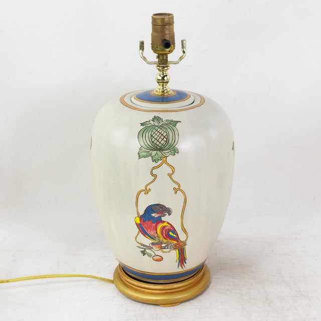 This striking pair of vintage table lamps features a classic ginger jar silhouette crafted from ceramic with a smooth,...