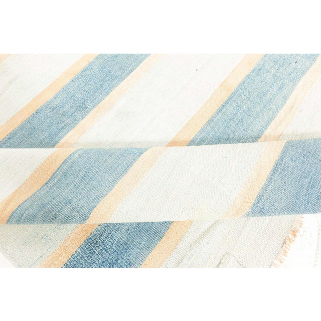 Vintage Indian Dhurrie Striped Blue Beige Ivory Rug Size: 6'10" × 10'0" (208 × 304 cm) This vintage Indian Dhurrie rug...