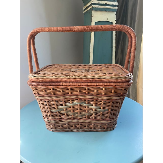 Step into the gilded romance of a 1920s Adirondack Great Camp. This spectacular, jumbo-format full-reed wicker hamper...