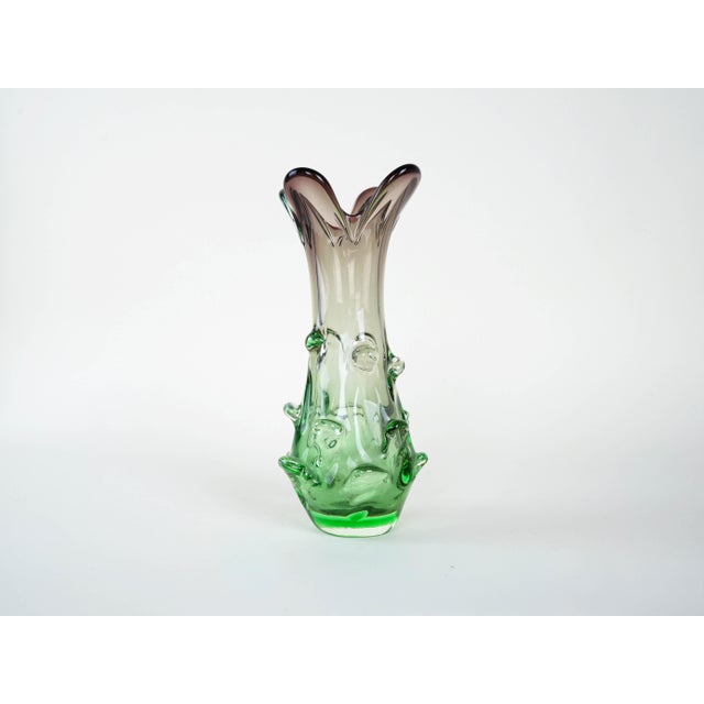 The vase was made in the 1960s in Italy. An impressive Murano vase from the 1960s, hand-formed from solid art glass. The...