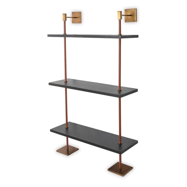 Modern multi-tier shelf in brown leather, aged brass and black! The shelf unit details urban simplicity with burnished...