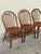 This refined set of three Danish modern dining chairs was designed by Erik Ole Jørgensen and produced by Tarm Stole...