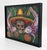 A vibrant and highly symbolic contemporary Mexican folk art painting by Nicaraguan artist Ricardo Maya, celebrating Día de...