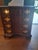 An exceptional mid-20th-century Georgian and Chippendale style block-front bachelor’s chest of drawers, showcasing the...