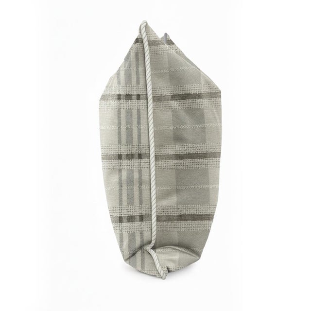 This woven fabric features a timeless plaid pattern in soft, neutral tones that blend modern sophistication with classic...