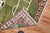 One of a kind hand-knotted 100 % vegetable-dyed rug depicting a soccer field surrounded by a traditional border. Measures:...