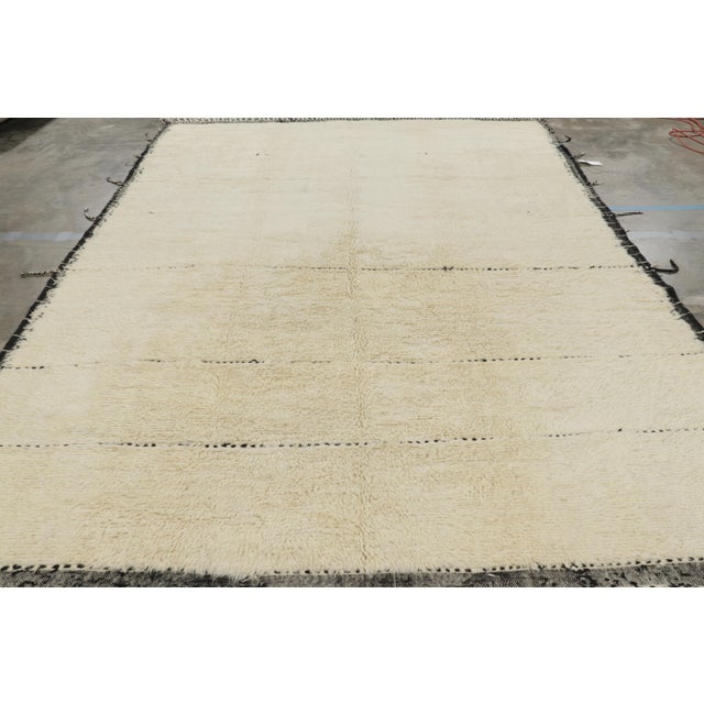 Handmade in wool, this 10x13 contemporary rug by Rug & Kilim is an exciting, modern reimagining of Moroccan rugs, and...