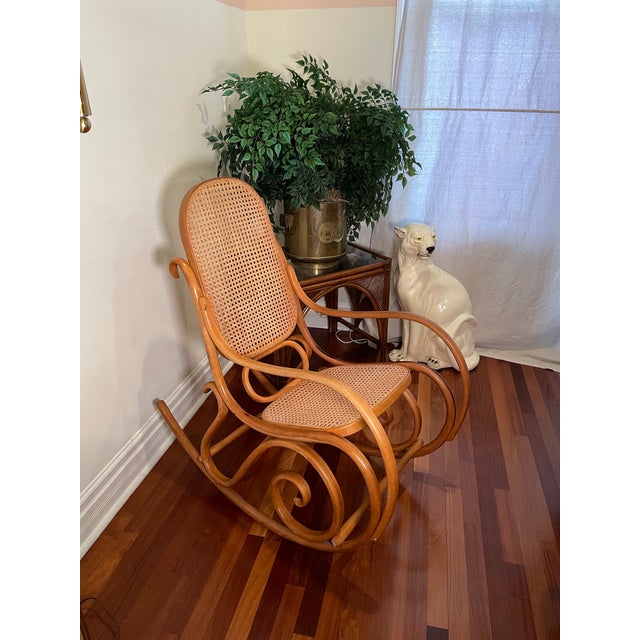 1970s Boho Vintage Bentwood Rocking Chair. Beautiful vintage bentwood rocking chair with curved steam-bent wood frame and...