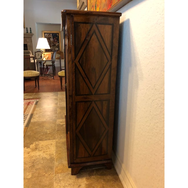 French XVII display cabinet certified by Azur Enchères, Cannes, France has rose wood veneer, ebony lines of marquetry with...