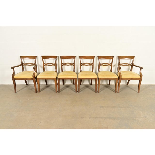 A gorgeous set of six Regency style dining chairs In the manner of Kindel Furniture USA, Circa 1960s Carved walnut frames,...