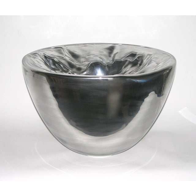 These monumental illuminated bowls in blown Murano glass, rarer in this silver version are decorated with a rock...