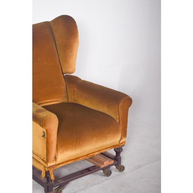 Hinged ear armchair. A unique armchair, both for its functionality and its classic design. Covered in golden velvet, the...