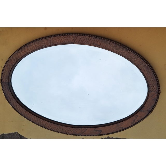 Antique Oval Wall Mirror in Oak, 1920s, in Very Good conditions. Designed 1920 to 1949