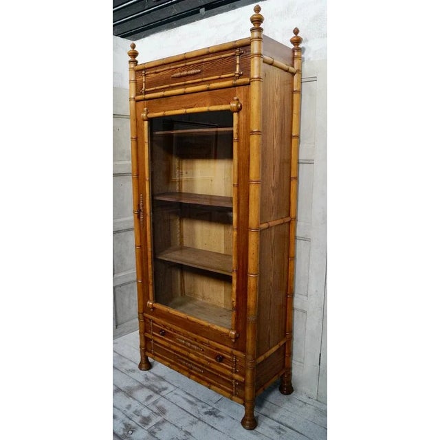 A Superb Antique Faux Bamboo Glazed Bookcase. Made from pine, comprising of 3 adjustable shelves, with a full glazed door...