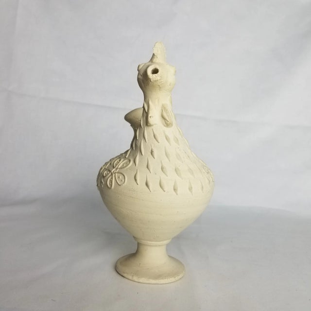 A lovely accent for your home, full of fun details with quite the personality. This pitcher, depicting the form of a...